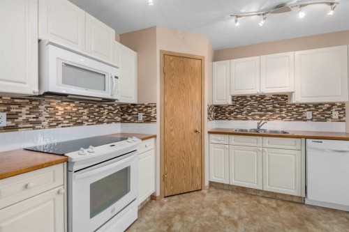 115 Chaparral Point Se, Calgary, AB - Indoor Photo Showing Kitchen With Double Sink