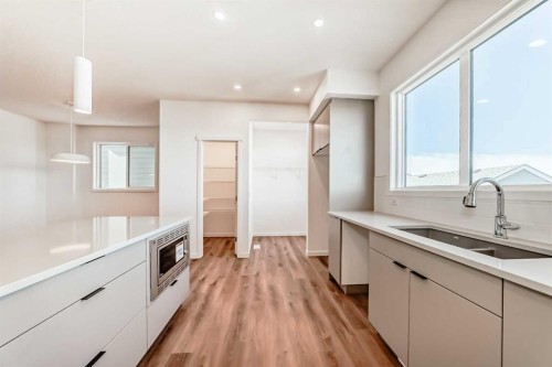 1038 Sawgrass Link Nw, Airdrie, AB - Indoor Photo Showing Kitchen With Double Sink