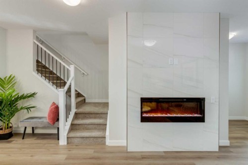 30 Tillotson Loop, Okotoks, AB - Indoor With Fireplace