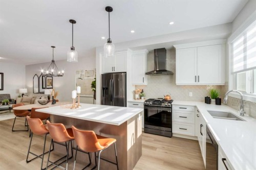 30 Tillotson Loop, Okotoks, AB - Indoor Photo Showing Kitchen With Stainless Steel Kitchen With Double Sink With Upgraded Kitchen