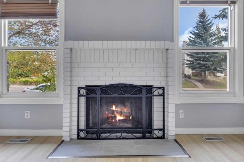 164 Deerview Way Se, Calgary, AB - Indoor Photo Showing Living Room With Fireplace