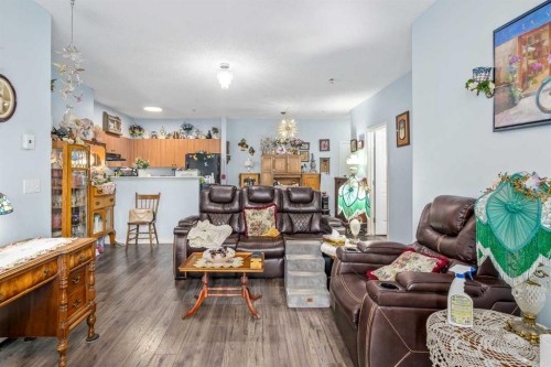 1116-1140 Taradale Drive Ne, Calgary, AB - Indoor Photo Showing Living Room