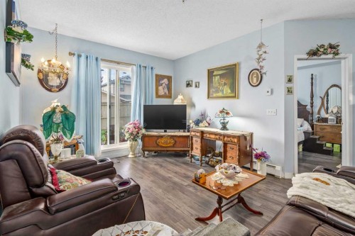 1116-1140 Taradale Drive Ne, Calgary, AB - Indoor Photo Showing Living Room