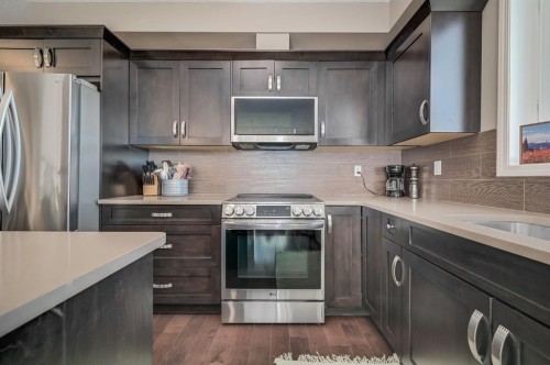 1302-522 Cranford Drive Se, Calgary, AB - Indoor Photo Showing Kitchen With Stainless Steel Kitchen With Upgraded Kitchen