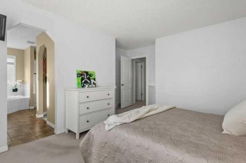 110 Cougar Ridge Circle Sw, Calgary, AB - Indoor Photo Showing Bedroom
