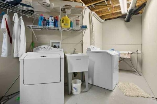 110 Cougar Ridge Circle Sw, Calgary, AB - Indoor Photo Showing Laundry Room