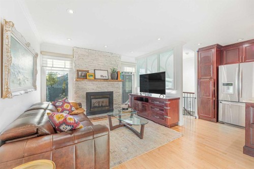 12235 Lake Fraser Way Se, Calgary, AB - Indoor Photo Showing Living Room With Fireplace