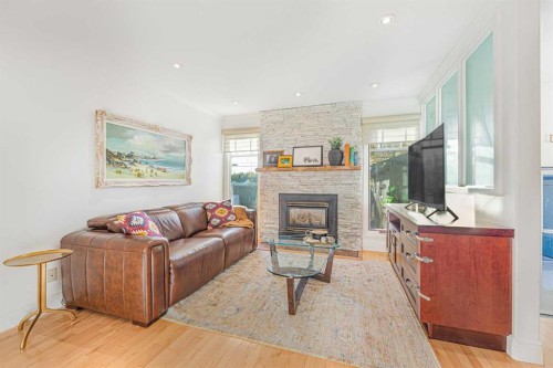 12235 Lake Fraser Way Se, Calgary, AB - Indoor Photo Showing Living Room With Fireplace