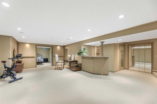 12235 Lake Fraser Way Se, Calgary, AB - Indoor Photo Showing Gym Room