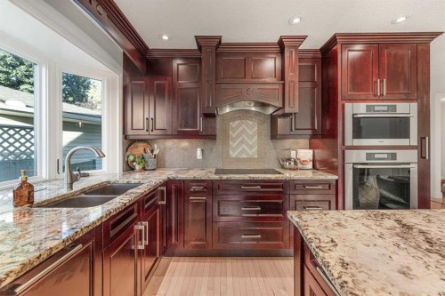 12235 Lake Fraser Way Se, Calgary, AB - Indoor Photo Showing Kitchen With Double Sink With Upgraded Kitchen
