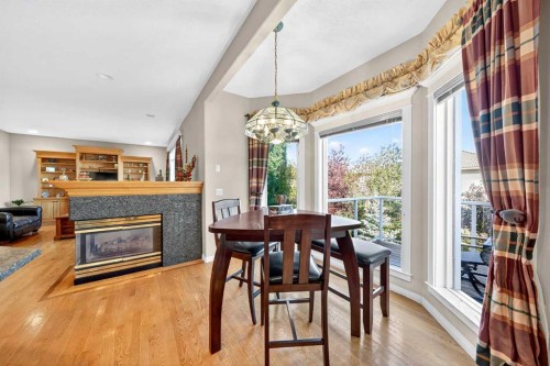 10345 Hamptons Boulevard Nw, Calgary, AB - Indoor Photo Showing Other Room With Fireplace