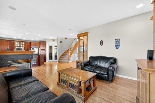 10345 Hamptons Boulevard Nw, Calgary, AB - Indoor Photo Showing Living Room With Fireplace