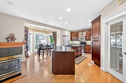 10345 Hamptons Boulevard Nw, Calgary, AB - Indoor Photo Showing Other Room With Fireplace