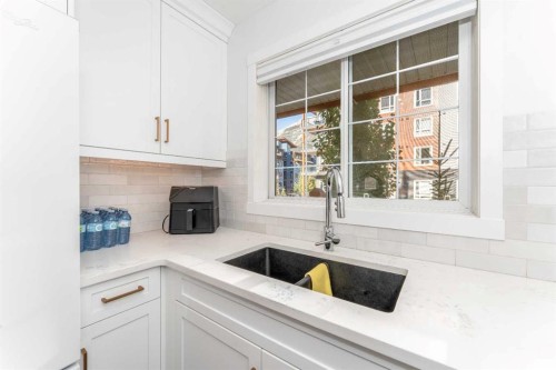 205-112 Kananaskis Way, Canmore, AB - Indoor Photo Showing Kitchen With Double Sink