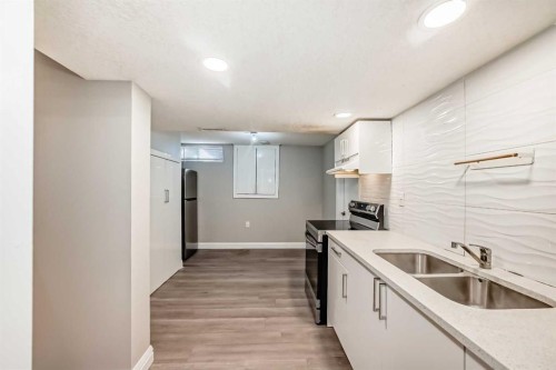 199 Maitland Drive Ne, Calgary, AB - Indoor Photo Showing Kitchen With Double Sink