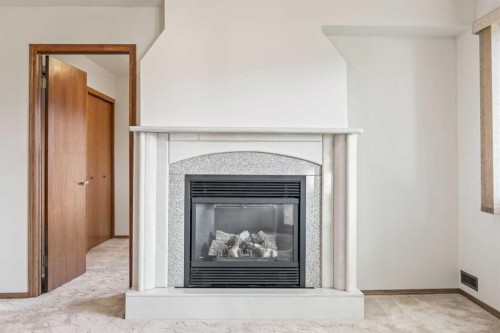 52 Sandarac Circle Nw, Calgary, AB - Indoor Photo Showing Living Room With Fireplace