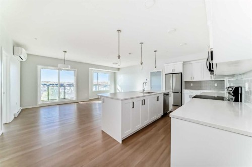 1305-42 Cranbrook Gardens Se, Calgary, AB - Indoor Photo Showing Kitchen With Stainless Steel Kitchen With Upgraded Kitchen
