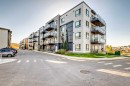 1305-42 Cranbrook Gardens Se, Calgary, AB  - Outdoor With Balcony With Facade 