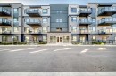 1305-42 Cranbrook Gardens Se, Calgary, AB  - Outdoor With Balcony With Facade 