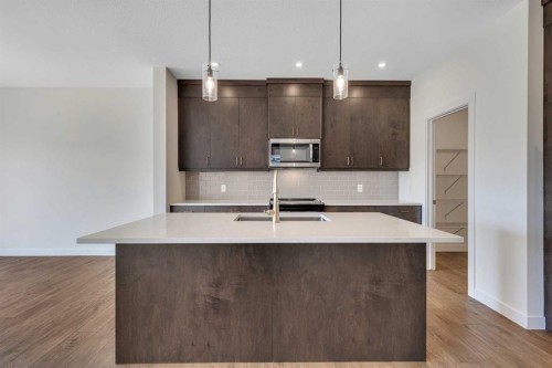 211 Creekstone Row Sw, Calgary, AB - Indoor Photo Showing Kitchen With Upgraded Kitchen