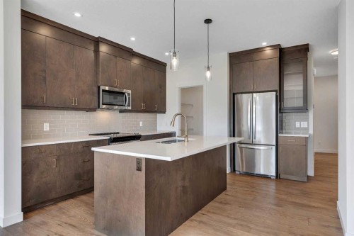 211 Creekstone Row Sw, Calgary, AB - Indoor Photo Showing Kitchen With Stainless Steel Kitchen With Upgraded Kitchen