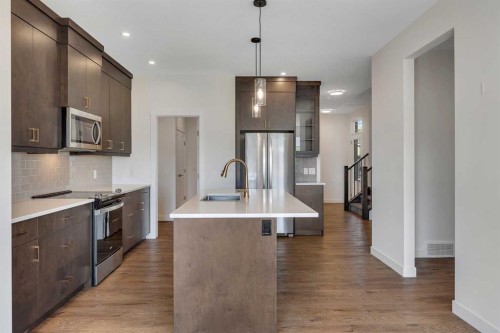 211 Creekstone Row Sw, Calgary, AB - Indoor Photo Showing Kitchen With Stainless Steel Kitchen With Upgraded Kitchen