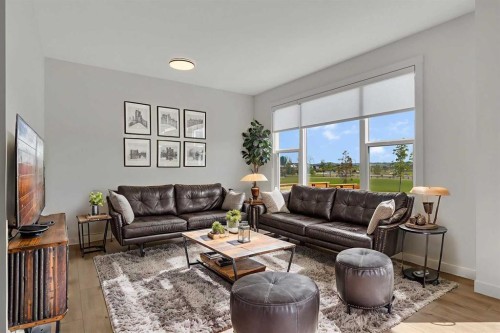 211 Creekstone Row Sw, Calgary, AB - Indoor Photo Showing Living Room