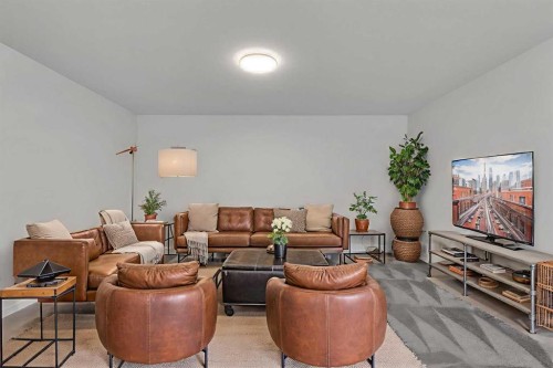 211 Creekstone Row Sw, Calgary, AB - Indoor Photo Showing Living Room