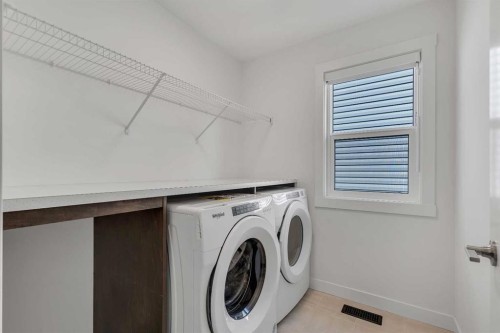 211 Creekstone Row Sw, Calgary, AB - Indoor Photo Showing Laundry Room