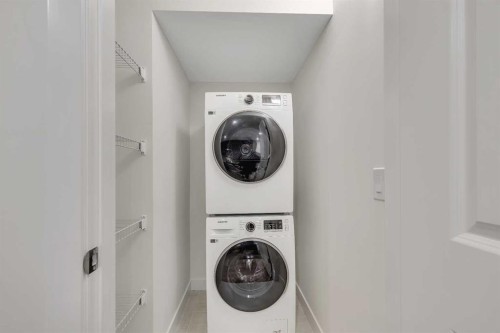 211 Creekstone Row Sw, Calgary, AB - Indoor Photo Showing Laundry Room