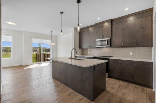211 Creekstone Row Sw, Calgary, AB - Indoor Photo Showing Kitchen With Upgraded Kitchen