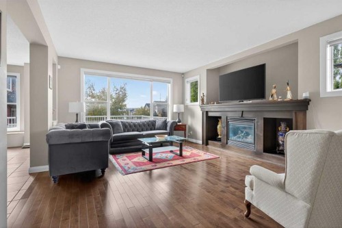 137 Evanspark Circle Nw, Calgary, AB - Indoor Photo Showing Living Room With Fireplace