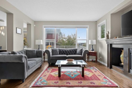 137 Evanspark Circle Nw, Calgary, AB - Indoor Photo Showing Living Room With Fireplace