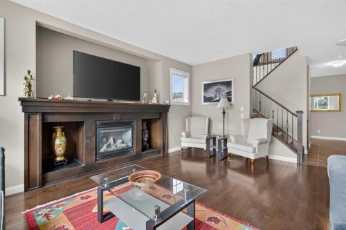 137 Evanspark Circle Nw, Calgary, AB - Indoor Photo Showing Living Room With Fireplace