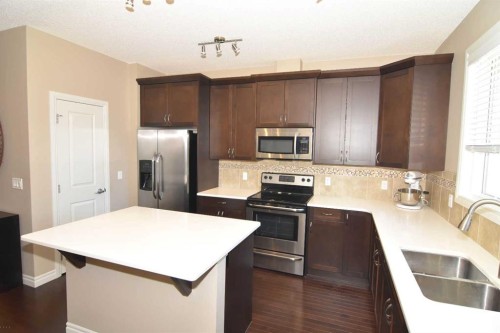 12 Legacy Gate Se, Calgary, AB - Indoor Photo Showing Kitchen With Stainless Steel Kitchen With Double Sink With Upgraded Kitchen