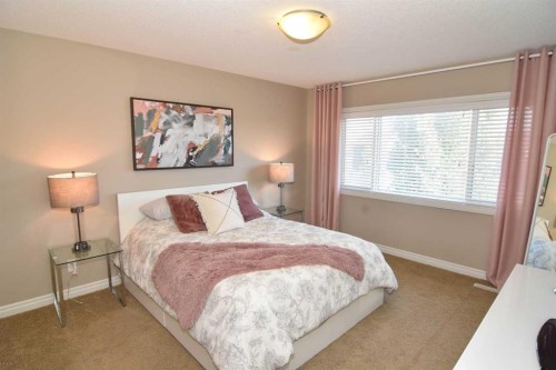 12 Legacy Gate Se, Calgary, AB - Indoor Photo Showing Bedroom