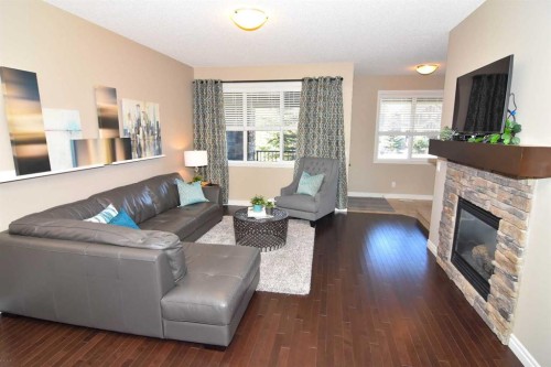12 Legacy Gate Se, Calgary, AB - Indoor Photo Showing Living Room With Fireplace