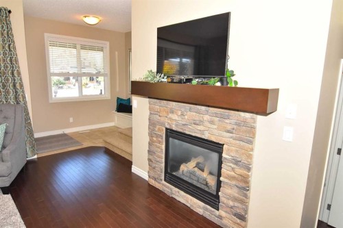 12 Legacy Gate Se, Calgary, AB - Indoor Photo Showing Living Room With Fireplace