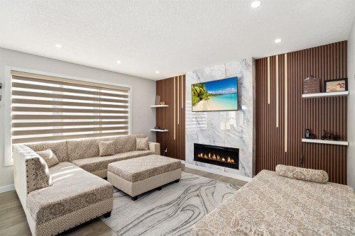 82 Red Sky Road Ne, Calgary, AB - Indoor Photo Showing Living Room With Fireplace