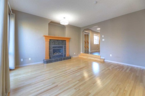 8903 Royal Oak Way Nw, Calgary, AB - Indoor Photo Showing Living Room With Fireplace