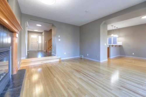 8903 Royal Oak Way Nw, Calgary, AB - Indoor Photo Showing Other Room With Fireplace