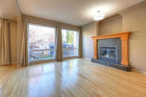 8903 Royal Oak Way Nw, Calgary, AB - Indoor Photo Showing Living Room With Fireplace