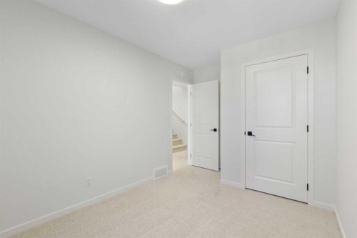 17 Marmot Passage Nw, Calgary, AB - Indoor Photo Showing Other Room