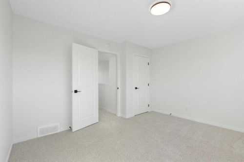 17 Marmot Passage Nw, Calgary, AB - Indoor Photo Showing Other Room