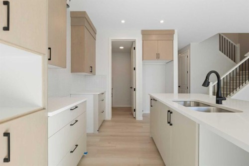 17 Marmot Passage Nw, Calgary, AB - Indoor Photo Showing Kitchen With Double Sink With Upgraded Kitchen