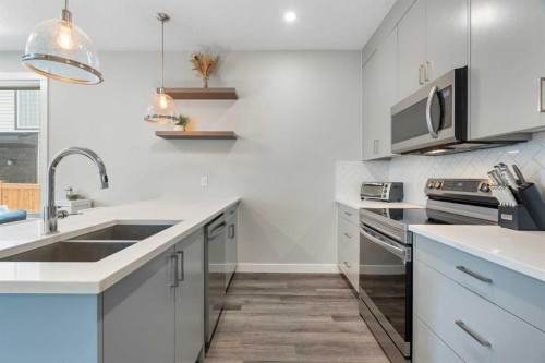 2-136 21 Avenue Ne, Calgary, AB - Indoor Photo Showing Kitchen With Stainless Steel Kitchen With Double Sink With Upgraded Kitchen
