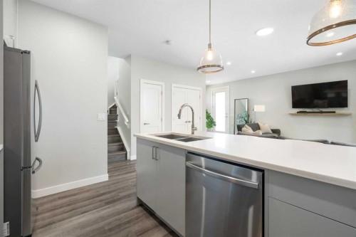 2-136 21 Avenue Ne, Calgary, AB - Indoor Photo Showing Kitchen With Stainless Steel Kitchen With Double Sink With Upgraded Kitchen