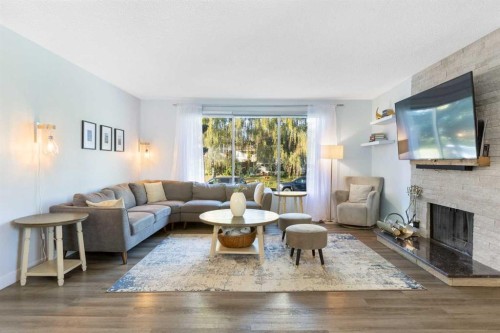 27 Deercrest Close Se, Calgary, AB - Indoor Photo Showing Living Room With Fireplace