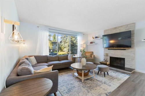 27 Deercrest Close Se, Calgary, AB - Indoor Photo Showing Living Room With Fireplace