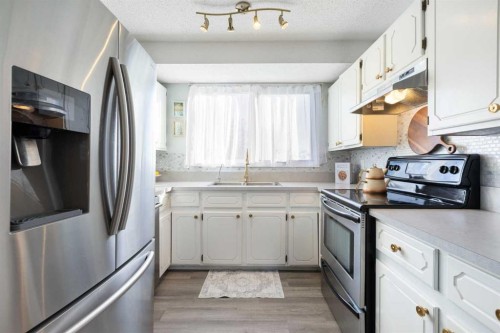 27 Deercrest Close Se, Calgary, AB - Indoor Photo Showing Kitchen With Stainless Steel Kitchen With Double Sink
